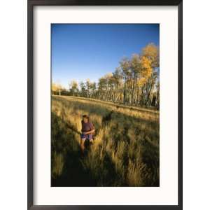  A Man Runs Through a Meadow of Tall Grass Near Mt. Elden 