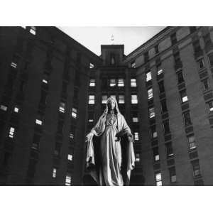 Statue of Mary in front of Catholic Hospital in Chicago, Symbolizing 