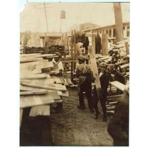  Photo Young boy working for Hickok Lumber Co., Burlington 