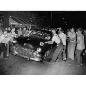  Crowd Attacking Cars Driven by African Americans to 