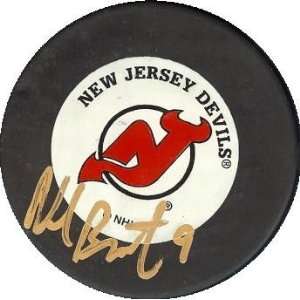  Neal Broten autographed Hockey Puck (New Jersey Devils 