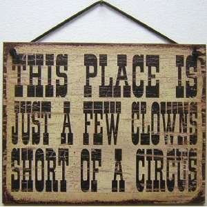 Vintage Style Sign Saying, THIS PLACE IS JUST A FEW CLOWNS SHORT OF A 
