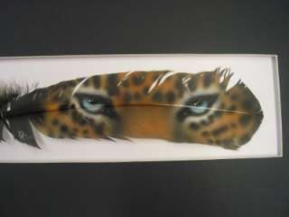 This auction is for a hand painted feather by artist Russ Abbott. The 