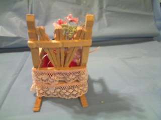 This VINTAGE LOOK DOLL CLOTHESPIN ROCKING CHAIR WITH RED VELVET PILLOW 