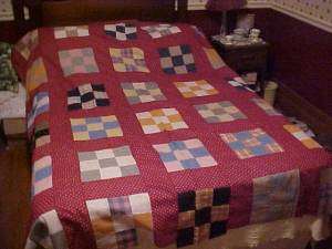   has a wonderful maroon sashing 4 5 wide a nice colorful quilt top