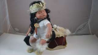   Goldenvale Porcelain Indian Baby Doll with Velvet Drum & Mallet  
