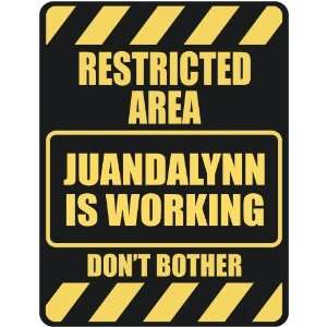   RESTRICTED AREA JUANDALYNN IS WORKING  PARKING SIGN 