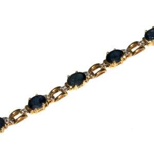 14k yellow gold oval faceted blue sapphire and diamond bracelet. 8 1/4 