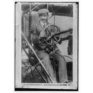  Photo Glenn Curtiss at pilots wheel of his biplane 1900 