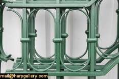 Seven arched sections of wrought iron fence plus 9 mounting posts 