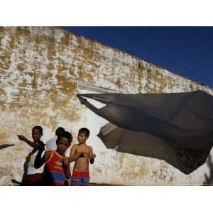  A Group of Children Fly Plastic Bags, Known as Papalotes 