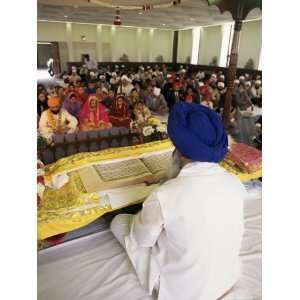  Sikh Priest and Holy Book at Sikh Wedding, London, England 